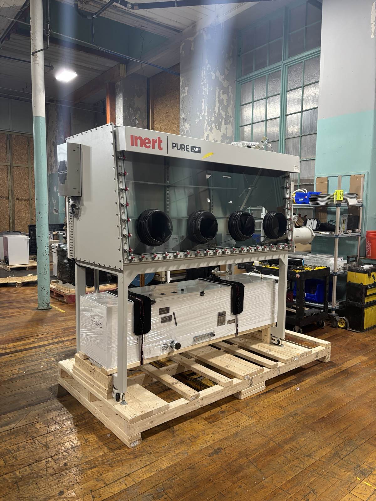 A stainless steel industrial isolation chamber, crated and ready to ship.